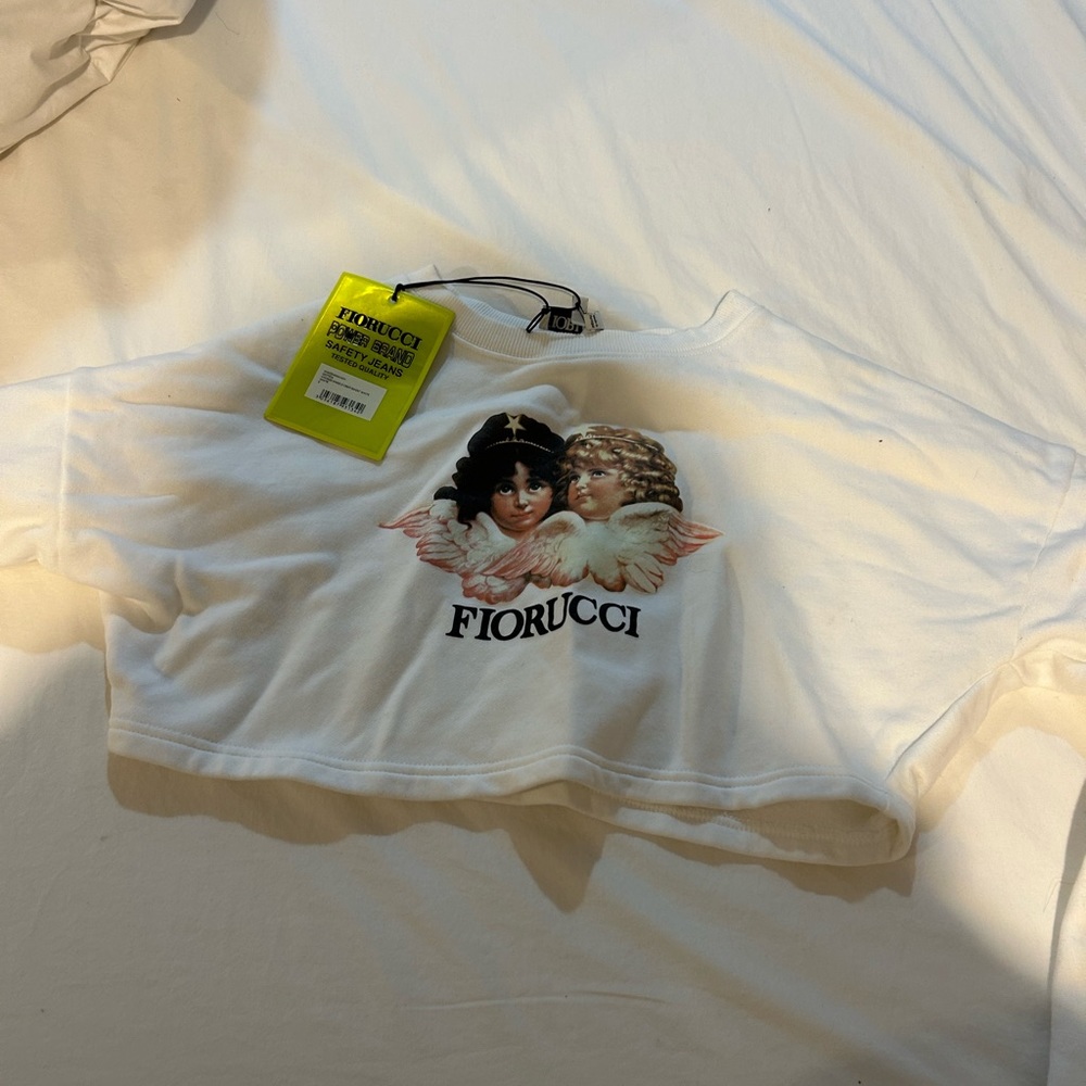 Cropped sweatshirt, never worn with tags. More than perfect condition